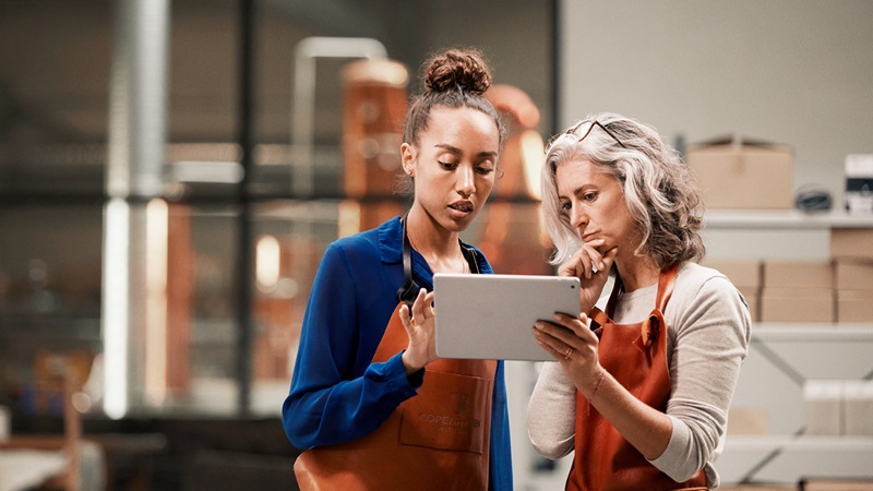Females in warehouse with tablet Females in warehouse with tablet